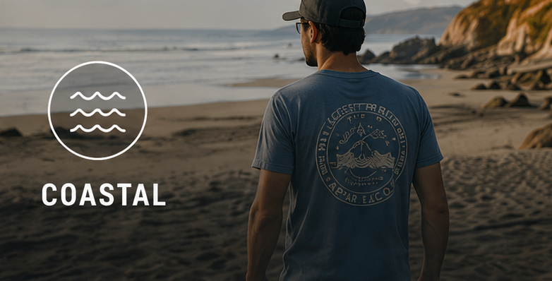 Person wearing coastal t-shirt looking at ocean