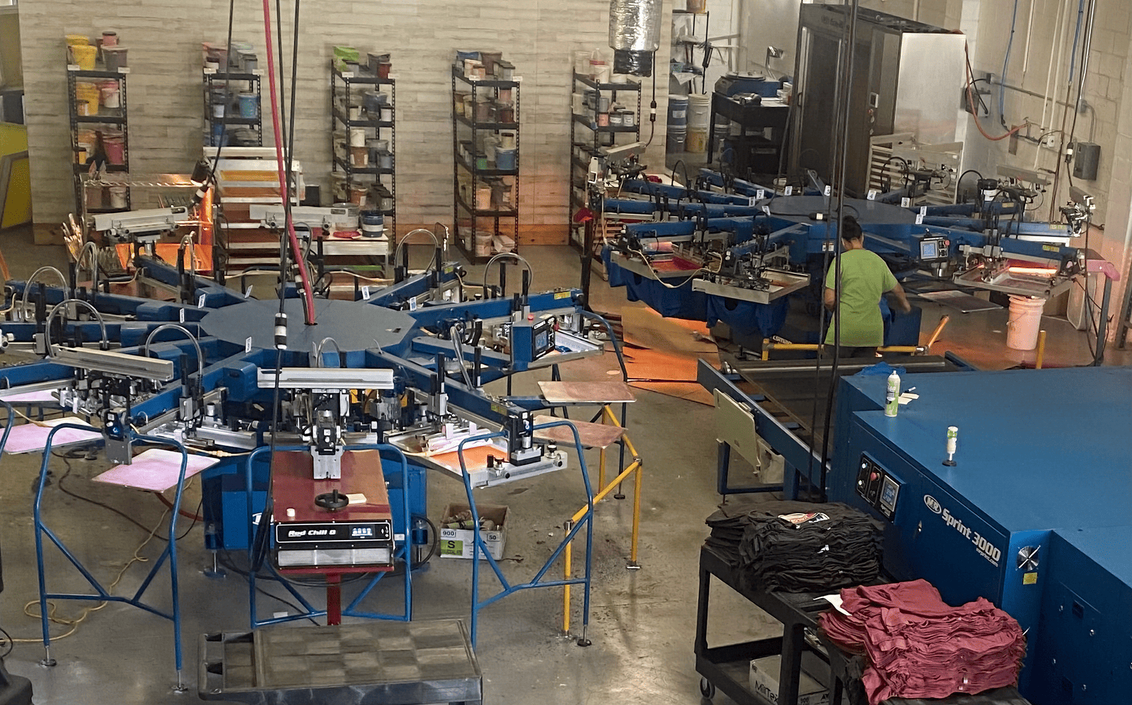 Commercial screen printing shop with carousel presses